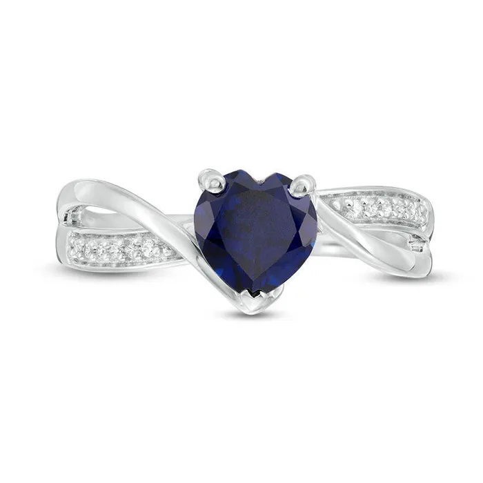 60mm HeartShaped LabCreated Blue Sapphire and 005 CT TW Diamond Crossover Bypass Promise Ring in Sterling Silver Goldia Rings 60mm HeartShaped LabCreated Blue Sapphire and 005 CT TW Diamond Crossover Bypass Promise Ring in Sterling Silver Goldia Rings